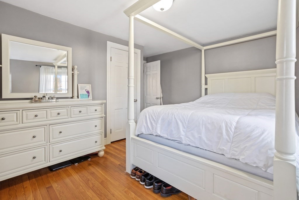 63 Maple Street Middleton, MA 01949 - Photo 16 of 36 a bedroom with a bed and a dresser