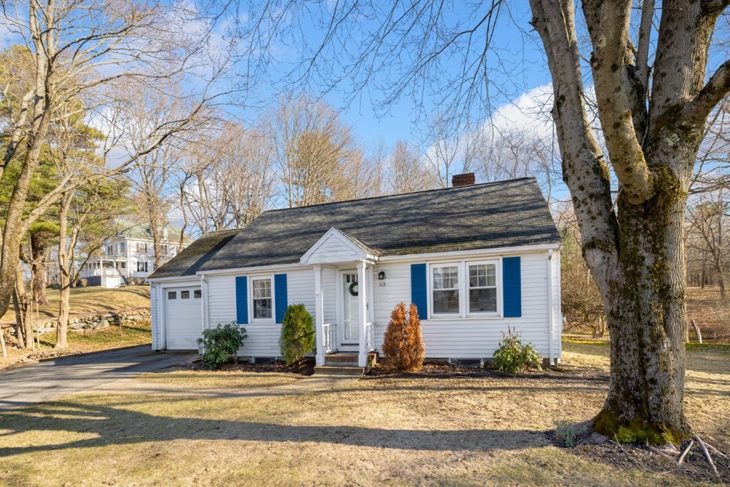 63 Maple Street Middleton, MA 01949 - Photo 2 of 36 a front view of a house with a yard