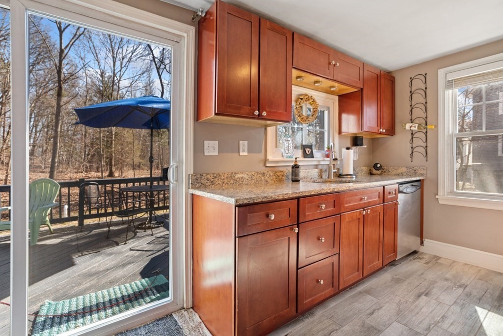 63 Maple Street Middleton, MA 01949 - Photo 9 of 36 a kitchen with stainless steel appliances granite countertop a refrigerator and a sink