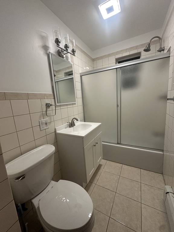 269 South Broadway, Unit 2 Lawrence, MA 01843 - Photo 12 of 12 a bathroom with a toilet sink and shower