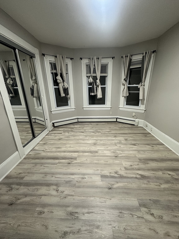 269 South Broadway, Unit 2 Lawrence, MA 01843 - Photo 4 of 12 a view of an empty room with window and stairs