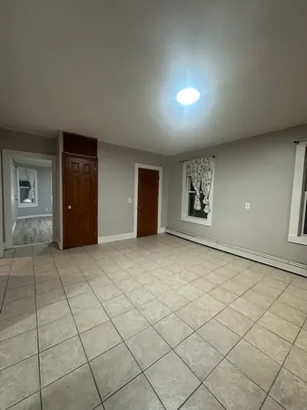 a view of an empty room and window