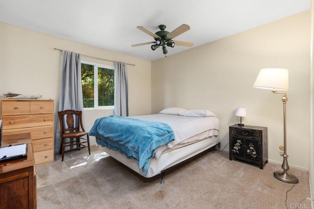 29560 Lilac Road Valley Center, CA 92082 - Photo 23 of 43 a bedroom with a bed and a window