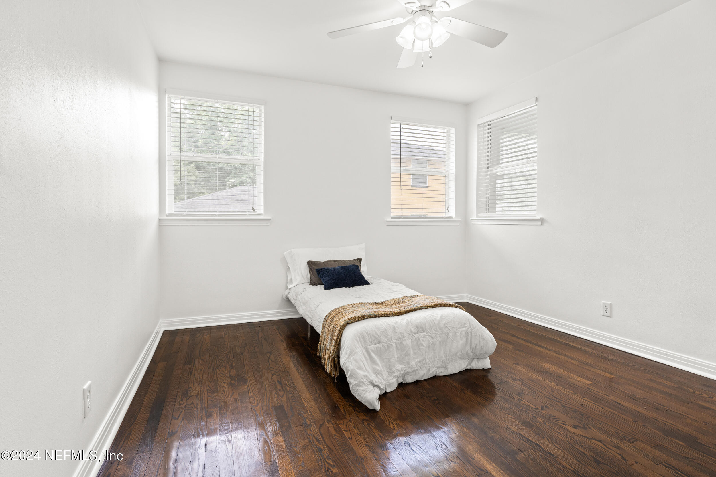 755 Old Hickory Road Jacksonville, FL 32207 - Photo 23 of 30 a room with a bed and wooden floor