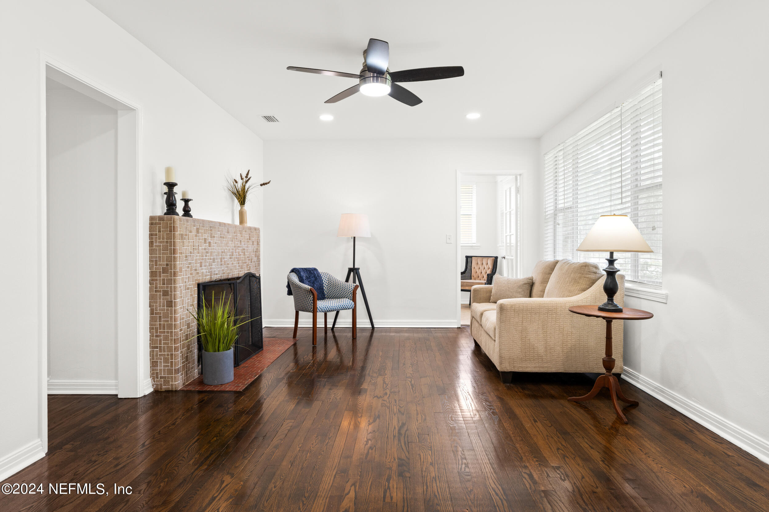 755 Old Hickory Road Jacksonville, FL 32207 - Photo 5 of 30 a living room with furniture dining table and a fireplace