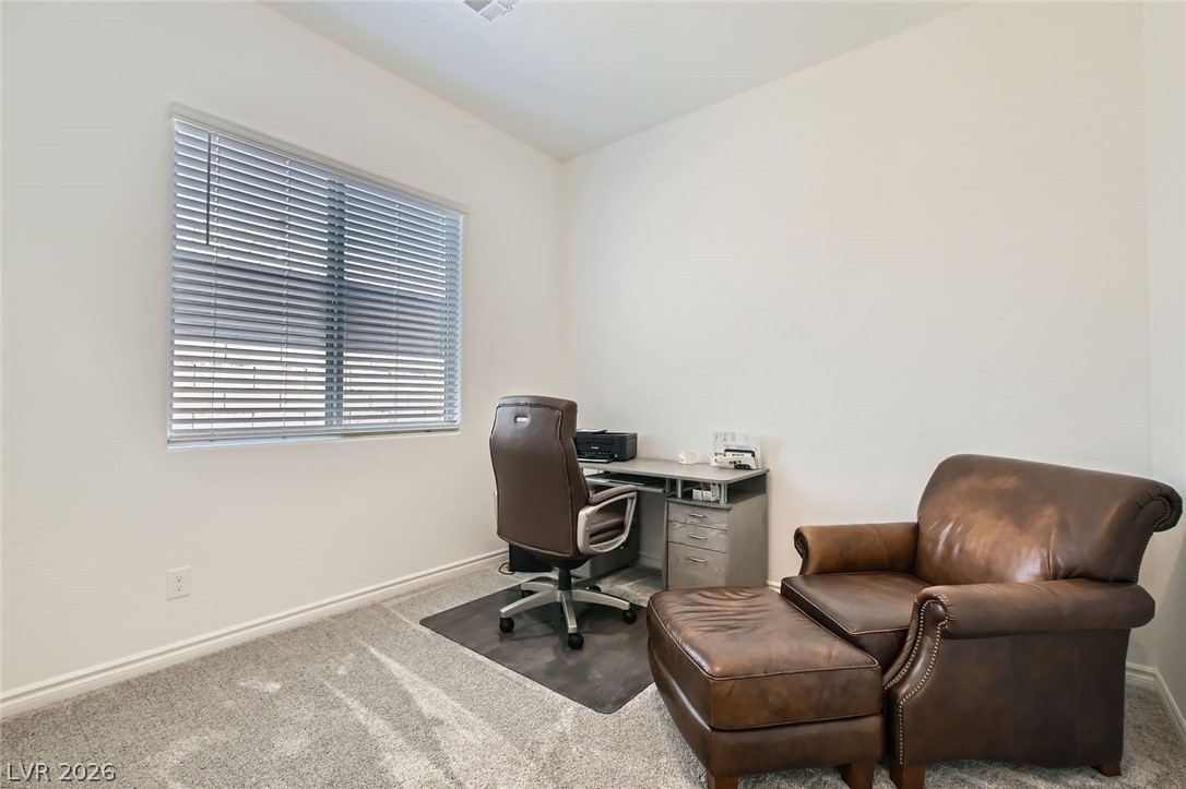 498 Pebble Run Avenue Henderson, NV 89011 - Photo 18 of 47 This dedicated office space provides a productive environment with natural light and comfortable seating.