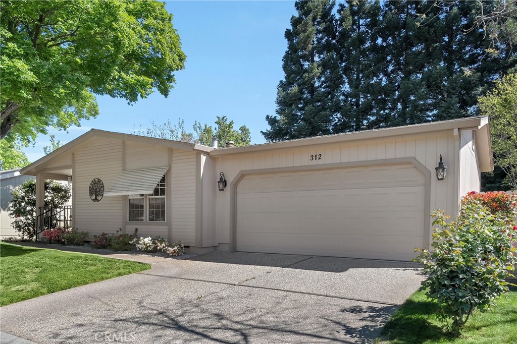 2050 Springfield Drive, Unit 312 Chico, CA 95928 - Photo 1 of 1 a view of a house with a yard