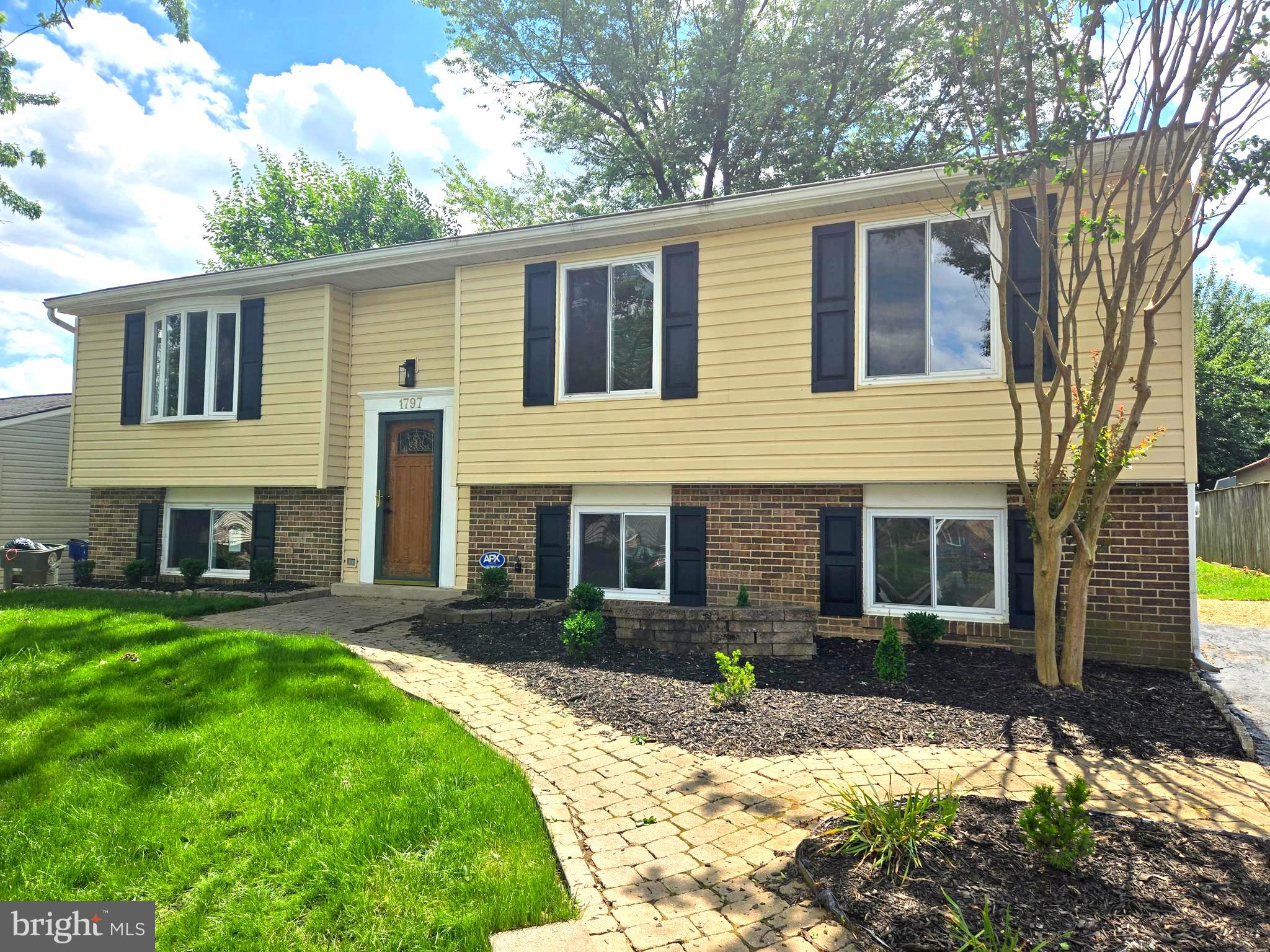 1797 Valleyside Drive Frederick, MD 21702 - Photo 1 of 38 a front view of a house with a yard and garage