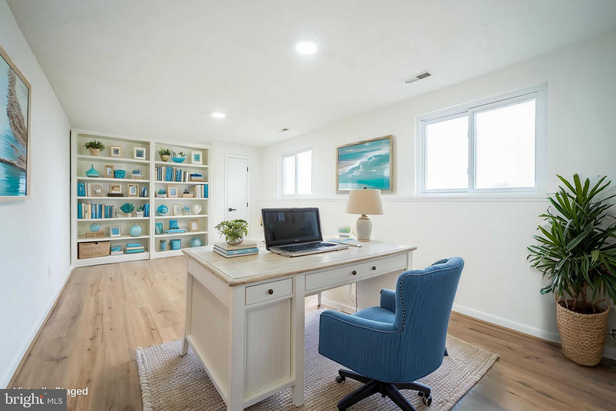1797 Valleyside Drive Frederick, MD 21702 - Photo 12 of 38 a view of a workspace with furniture and a potted plant