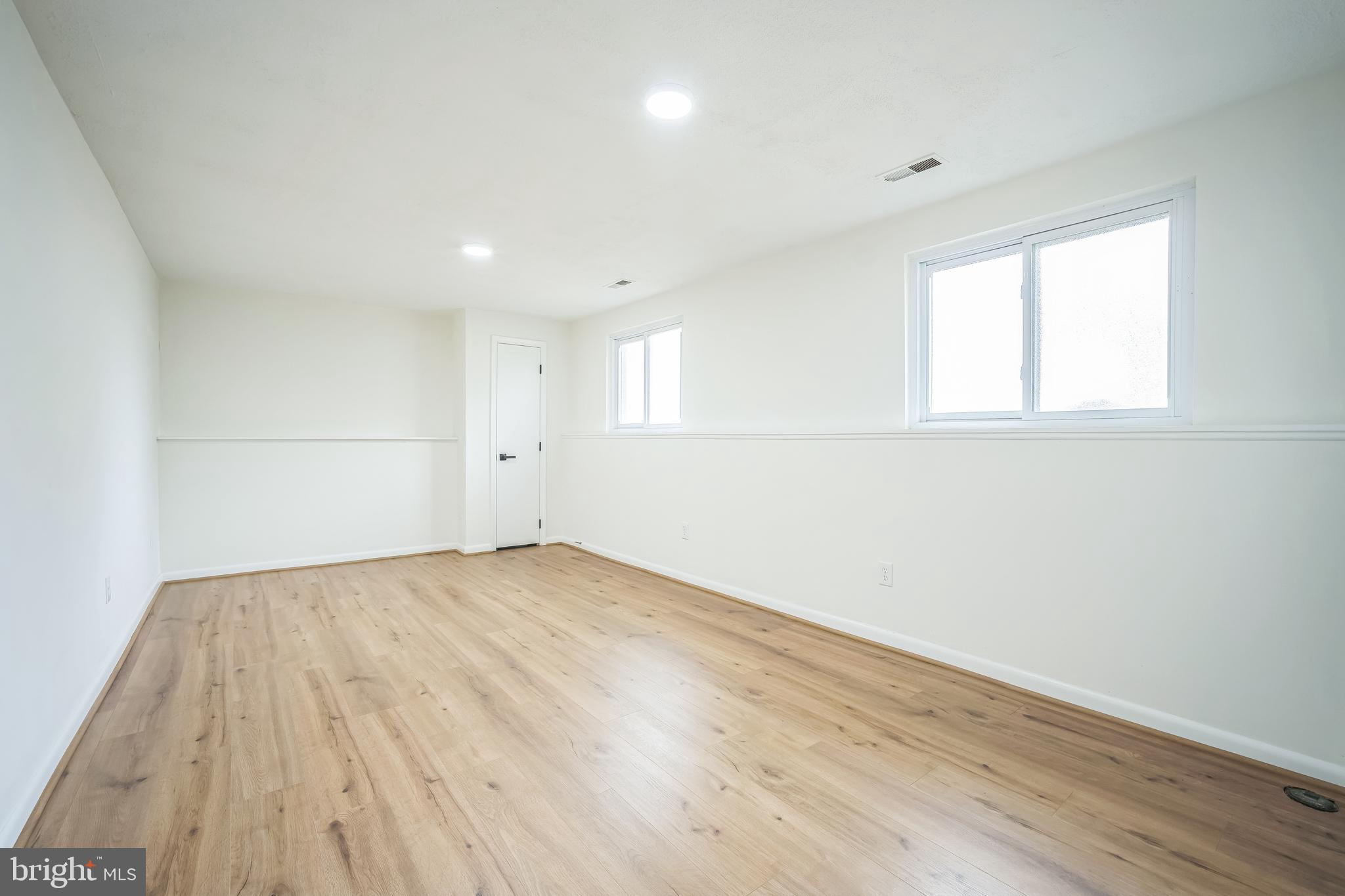 1797 Valleyside Drive Frederick, MD 21702 - Photo 13 of 38 an empty room with wooden floor and windows
