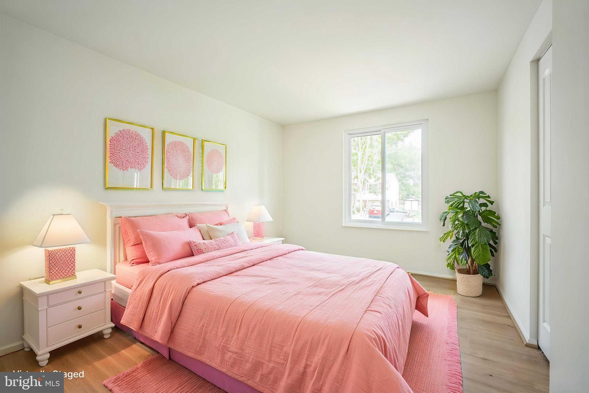 1797 Valleyside Drive Frederick, MD 21702 - Photo 18 of 38 a bedroom with a bed and a potted plant