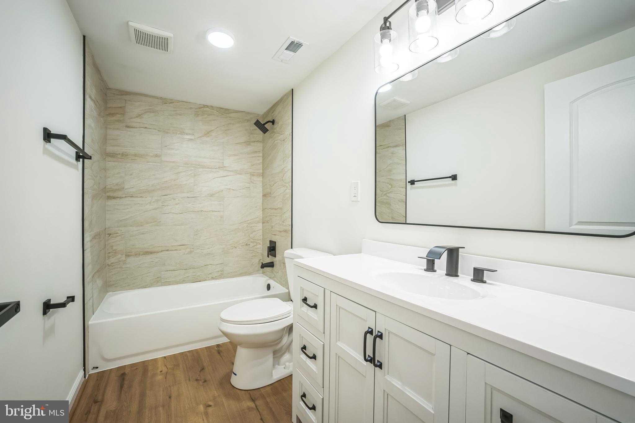 1797 Valleyside Drive Frederick, MD 21702 - Photo 26 of 38 a bathroom with a sink a toilet and shower