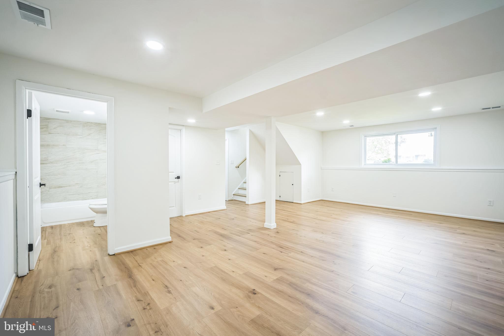 1797 Valleyside Drive Frederick, MD 21702 - Photo 27 of 38 a view of empty room with wooden floor and windows
