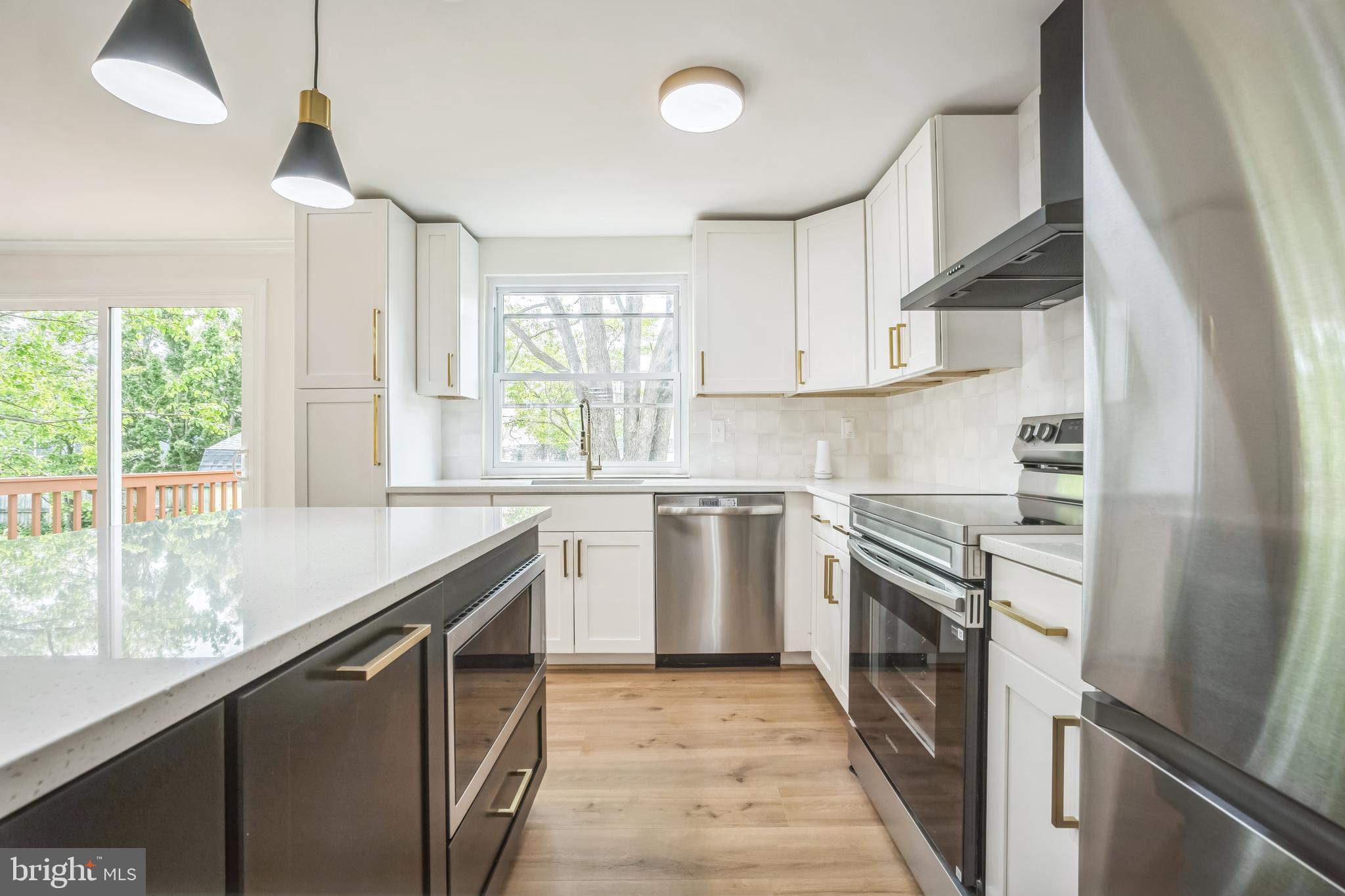 1797 Valleyside Drive Frederick, MD 21702 - Photo 3 of 38 a kitchen with granite countertop a sink stainless steel appliances and cabinets