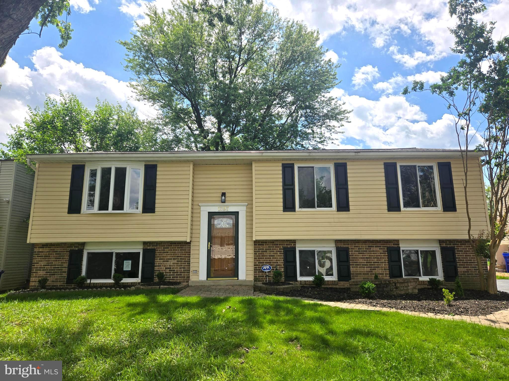 1797 Valleyside Drive Frederick, MD 21702 - Photo 34 of 38 a view of a house with a yard and a large tree