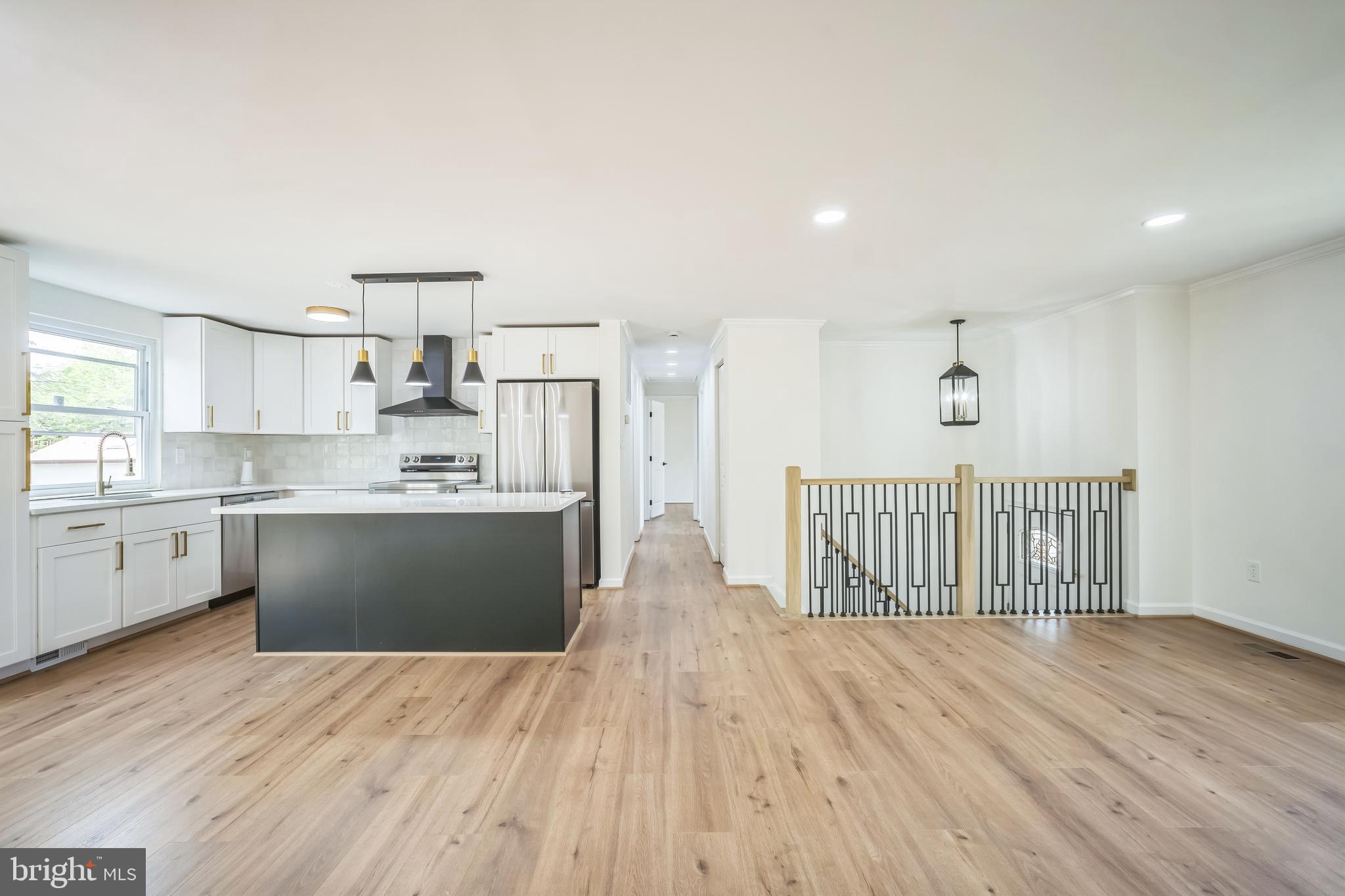 1797 Valleyside Drive Frederick, MD 21702 - Photo 4 of 38 a view of kitchen with wooden floor and electronic appliances