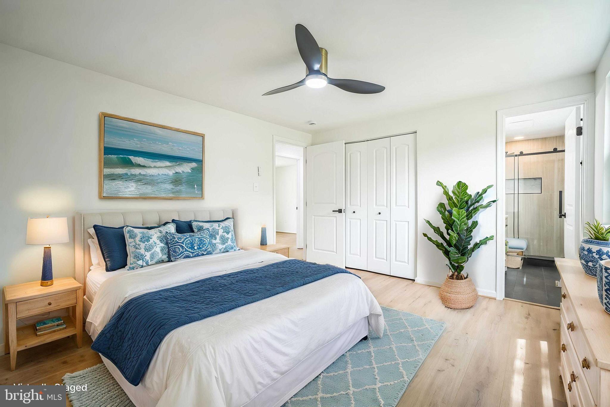 1797 Valleyside Drive Frederick, MD 21702 - Photo 7 of 38 a bedroom with a bed and a potted plant