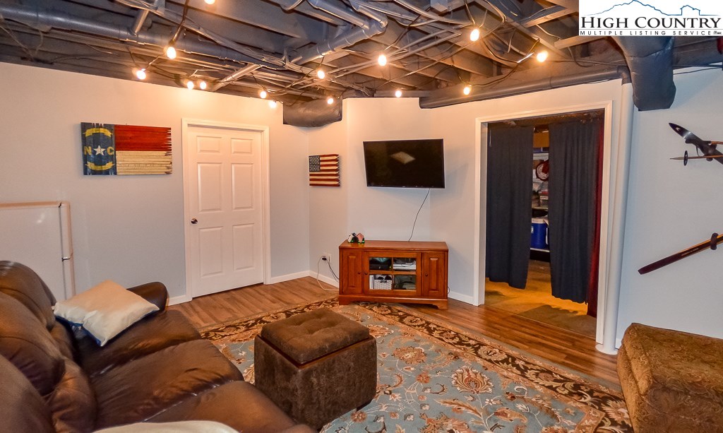 165 Wilson Ridge Road Boone, NC 28607 - Photo 17 of 22 a living room with furniture and a flat screen tv
