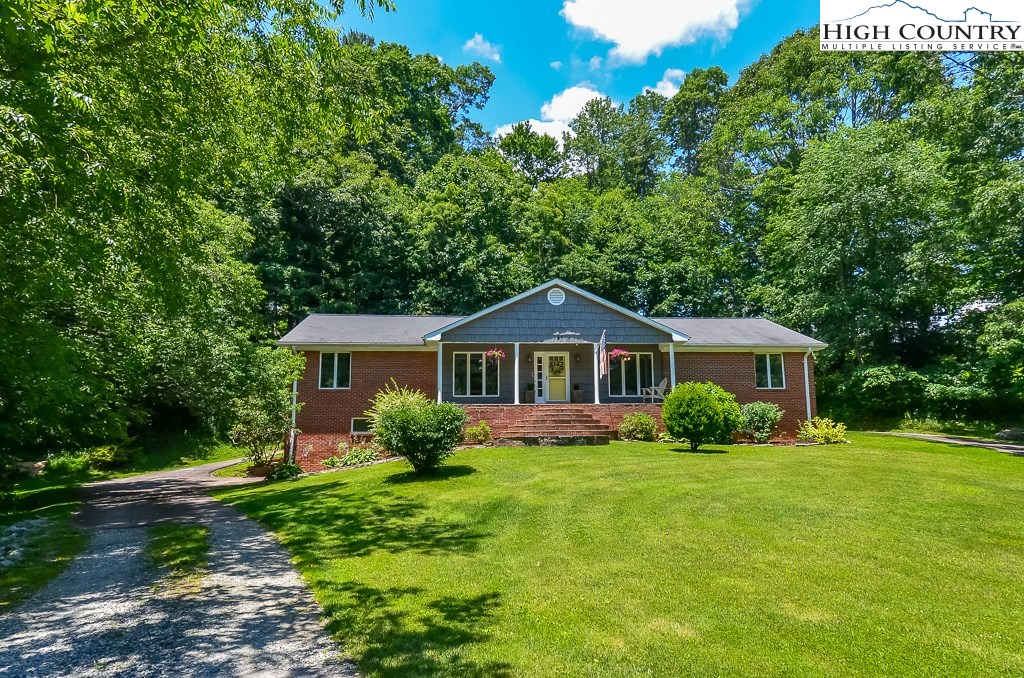 165 Wilson Ridge Road Boone, NC 28607 - Photo 2 of 22 a front view of house with yard and green space