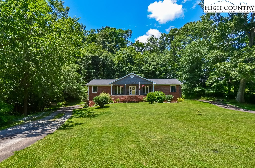 165 Wilson Ridge Road Boone, NC 28607 - Photo 22 of 22 a front view of a house with a garden