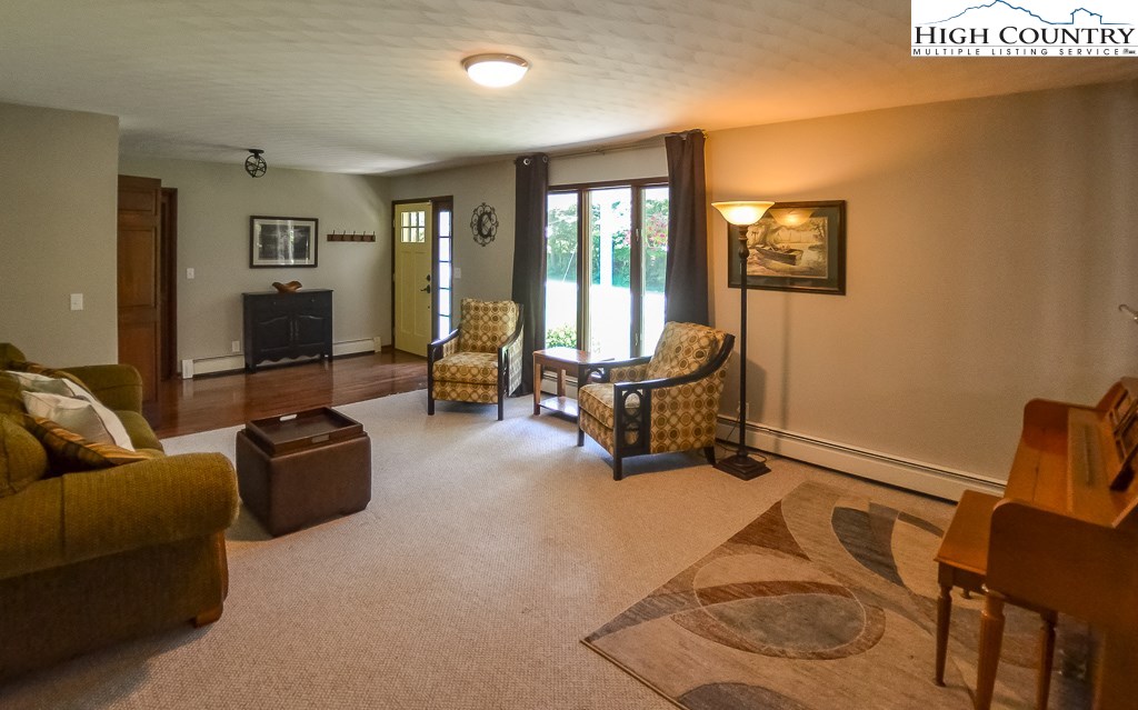 165 Wilson Ridge Road Boone, NC 28607 - Photo 3 of 22 a living room with furniture and a flat screen tv