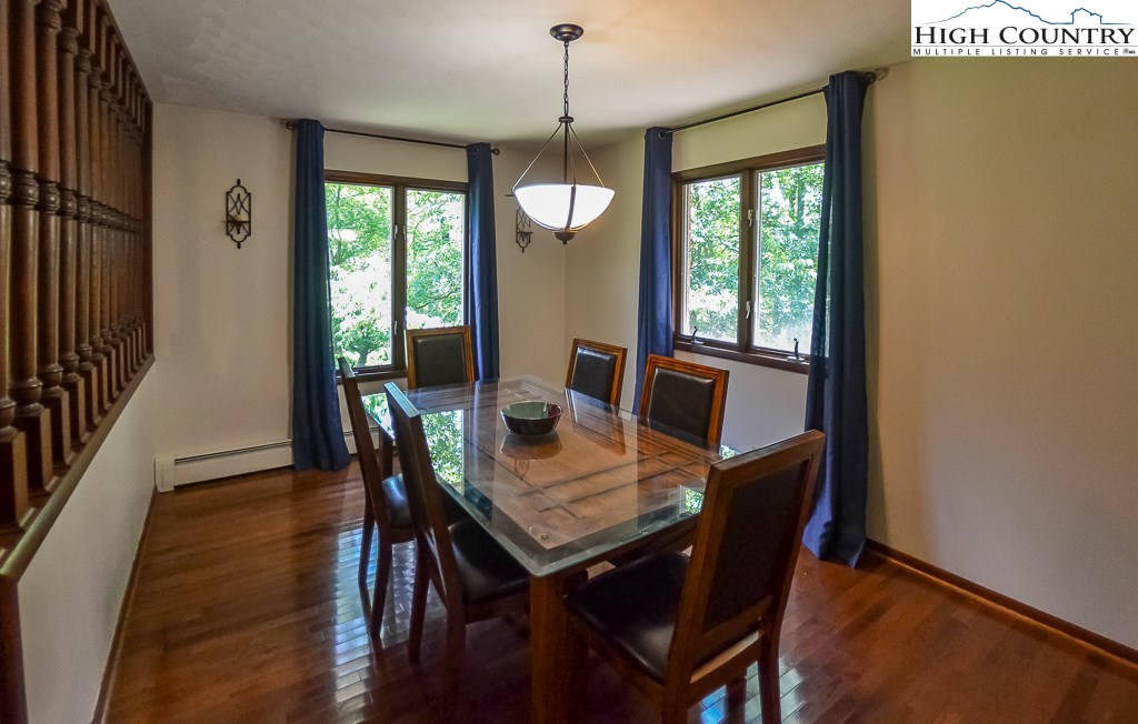 165 Wilson Ridge Road Boone, NC 28607 - Photo 5 of 22 a view of a dining room with furniture window and wooden floor