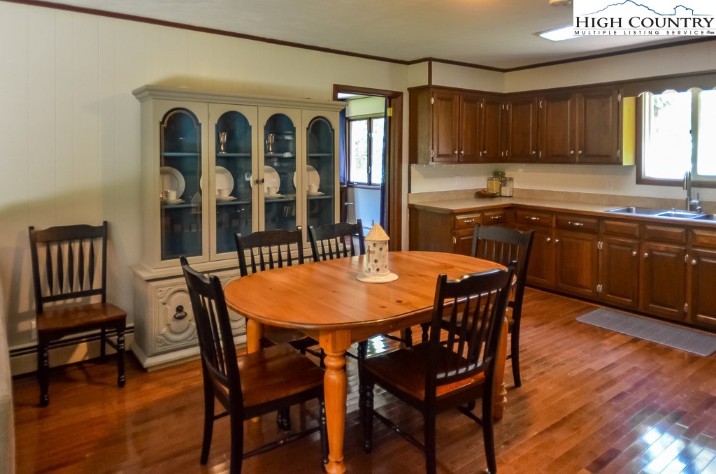 165 Wilson Ridge Road Boone, NC 28607 - Photo 7 of 22 a view of a dining room with furniture and window