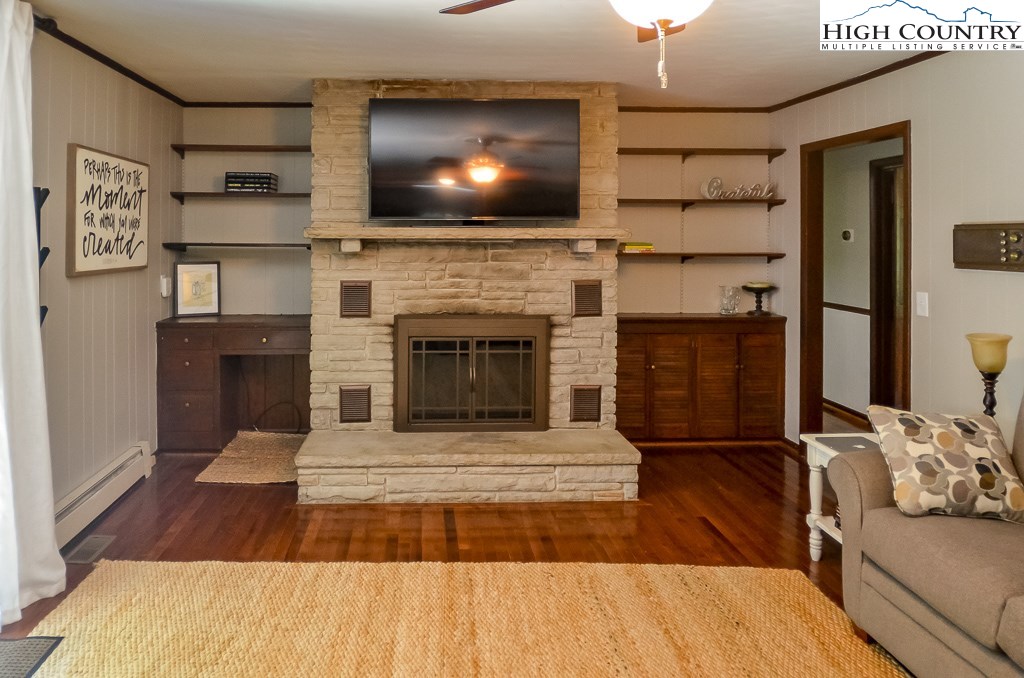 165 Wilson Ridge Road Boone, NC 28607 - Photo 10 of 22 a living room with furniture and a fireplace