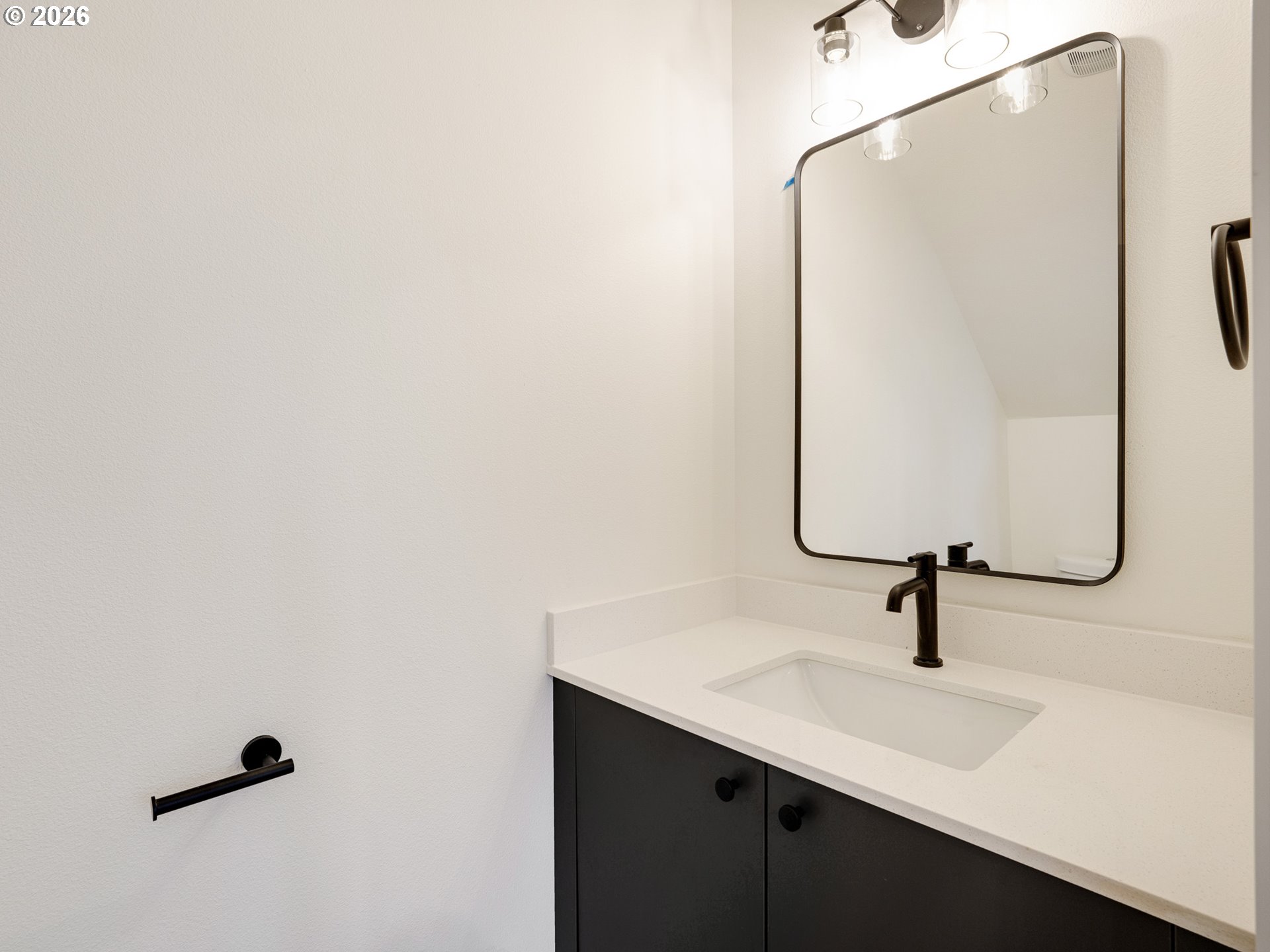 5871 Northeast Prescott Street Portland, OR 97218 - Photo 9 of 25 a bathroom with a sink and mirror