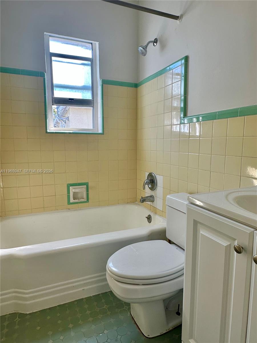 430 76th Street, Unit 4 Miami Beach, FL 33141 - Photo 13 of 24 a bathroom with a toilet a sink and bathtub
