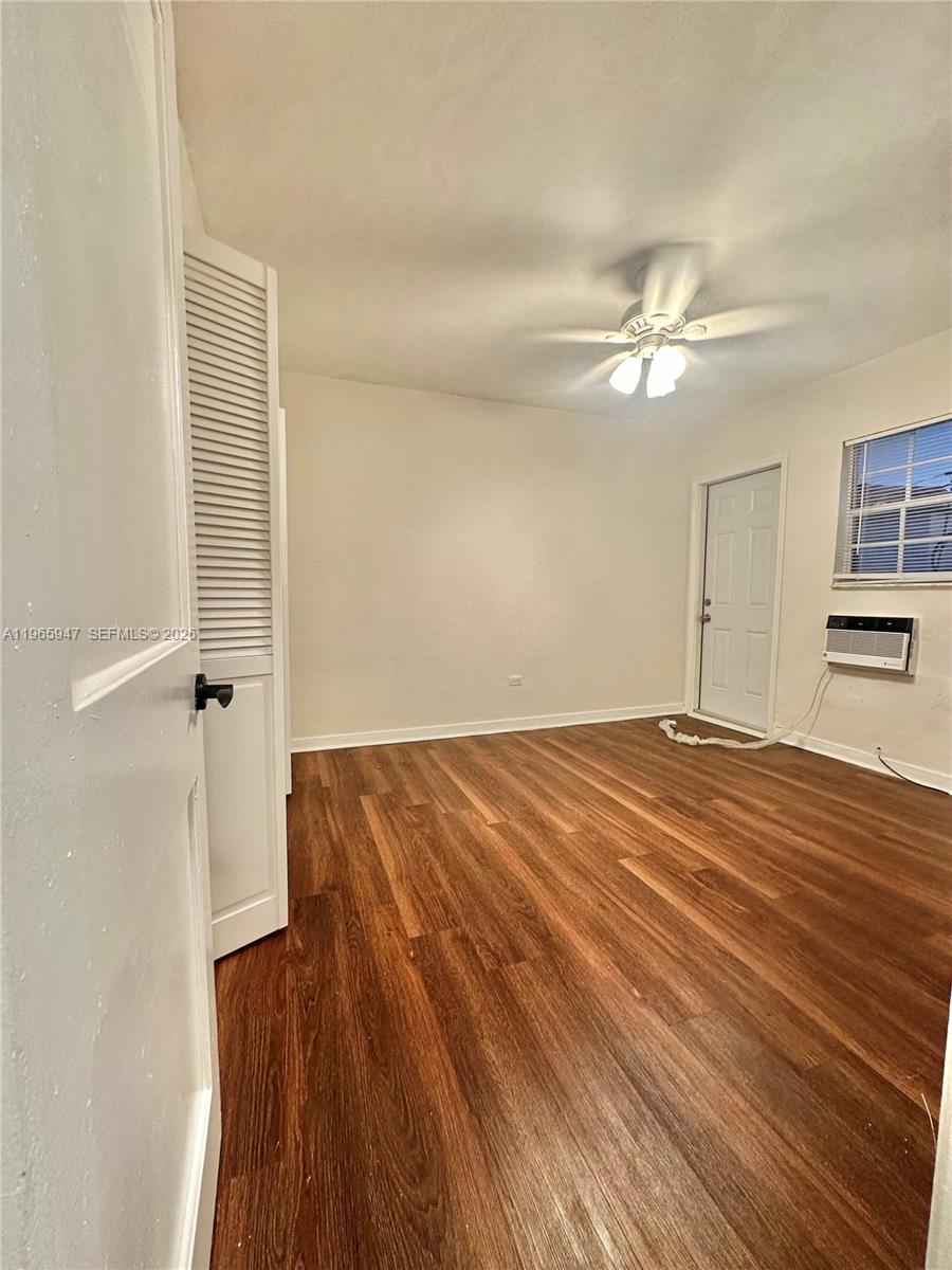 430 76th Street, Unit 4 Miami Beach, FL 33141 - Photo 17 of 24 wooden floor in an empty room with a window