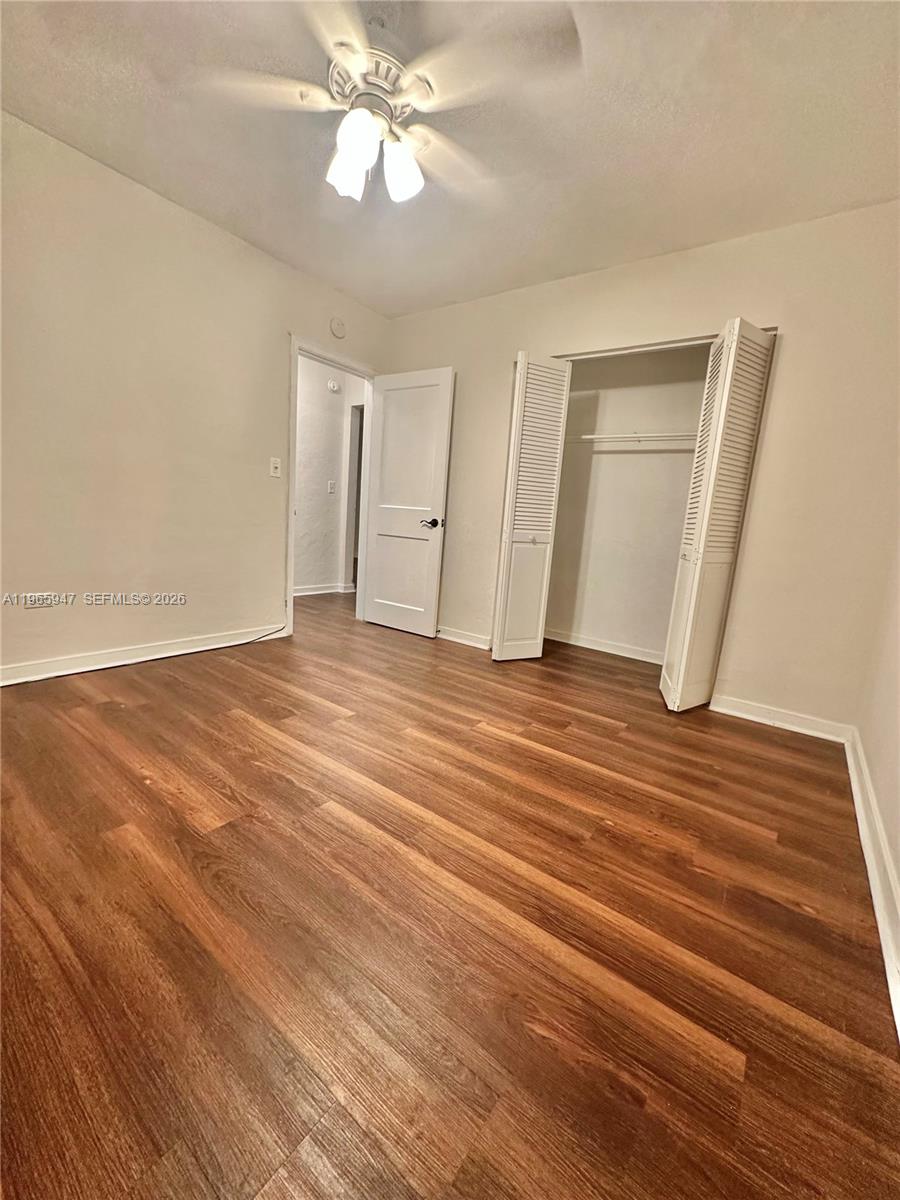 430 76th Street, Unit 4 Miami Beach, FL 33141 - Photo 18 of 24 wooden floor in an empty room
