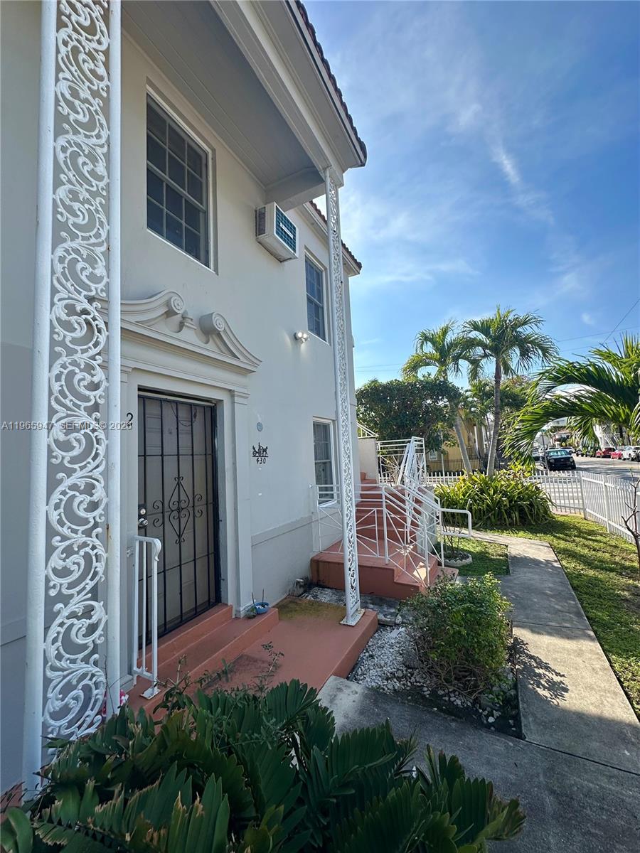 430 76th Street, Unit 4 Miami Beach, FL 33141 - Photo 24 of 24 a front view of a house with a yard