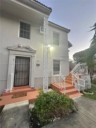 front view of a house with a street