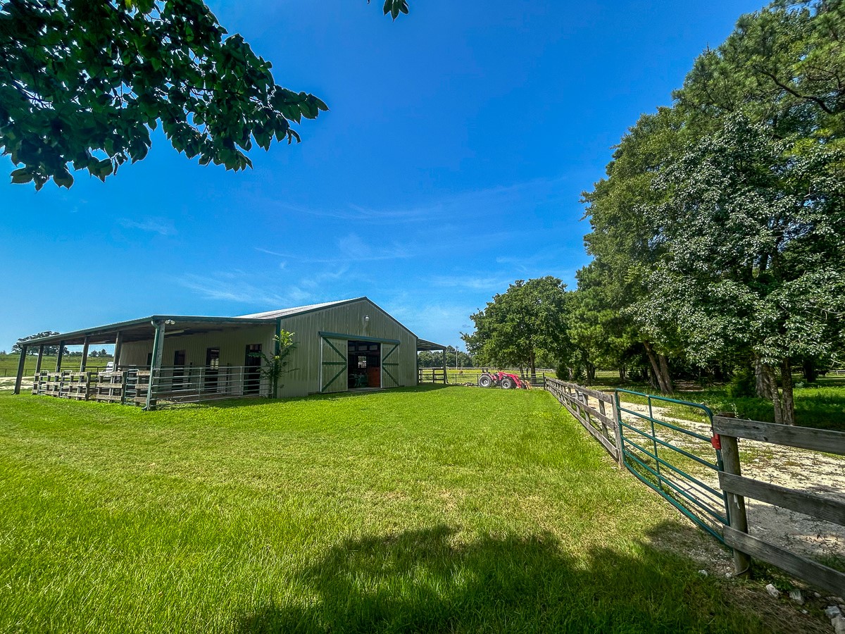 0 Fm 3179 Huntsville, TX 77340 - Photo 12 of 27 a view of a house with a yard and a garden