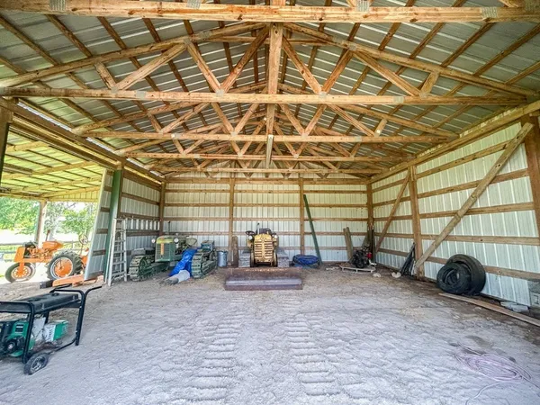 a view of a chairs and table in a backyard