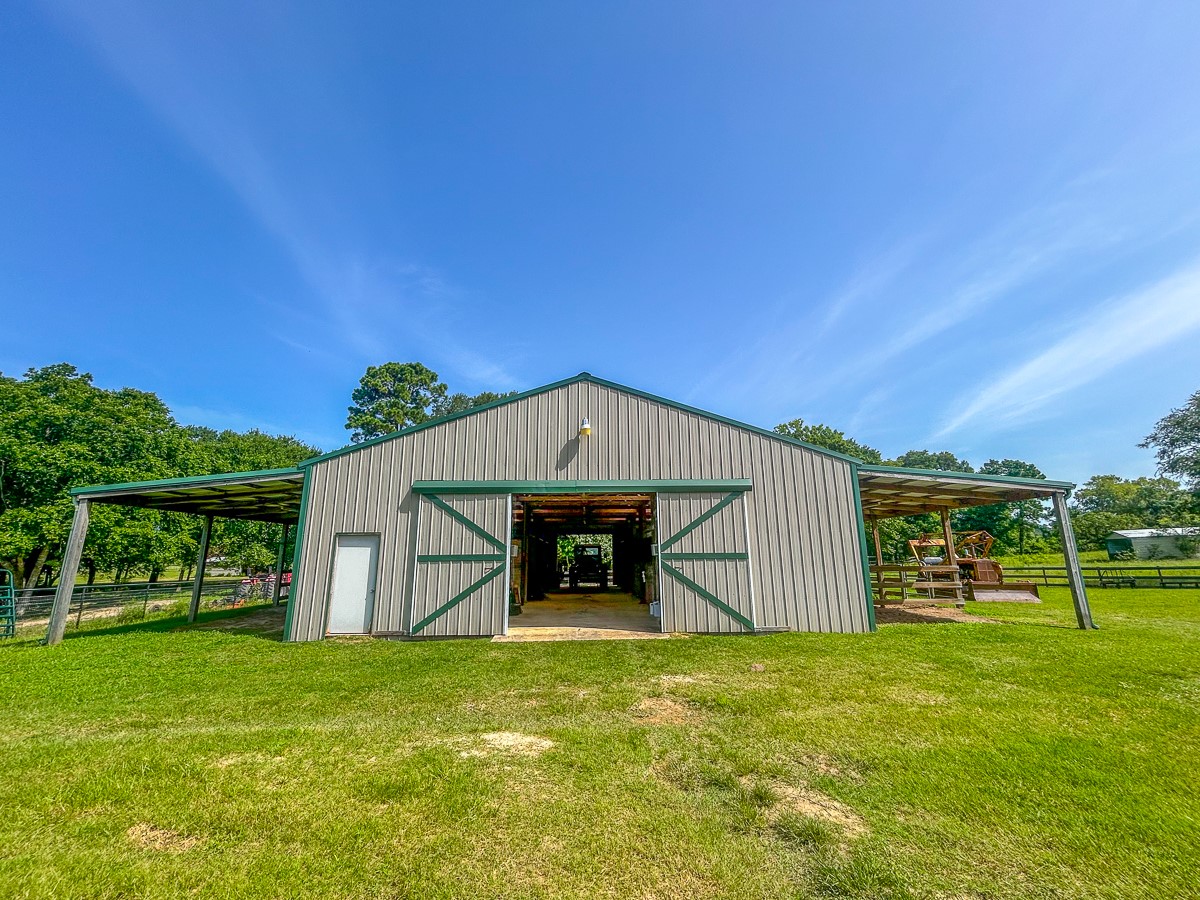 0 Fm 3179 Huntsville, TX 77340 - Photo 4 of 27 a front view of a house with a garden
