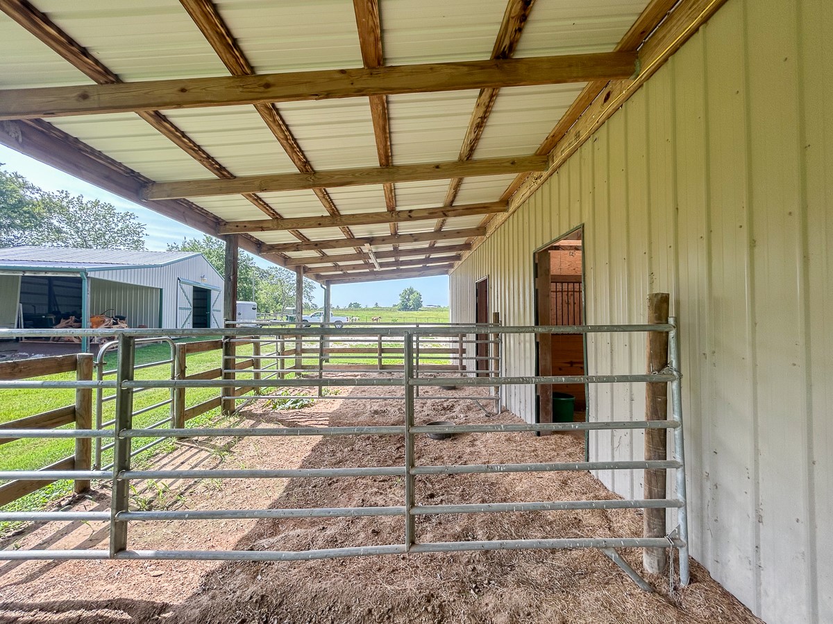 0 Fm 3179 Huntsville, TX 77340 - Photo 10 of 27 a view of a porch with wooden floor and iron stairs