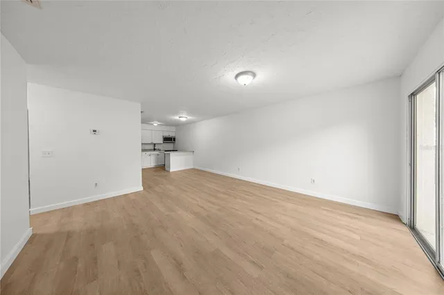 a spacious bathroom with a sink and a mirror