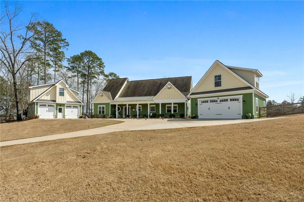 150 Crestview Road Jackson, GA 30233 - Photo 20 of 88 a front view of house with yard and trees in the background