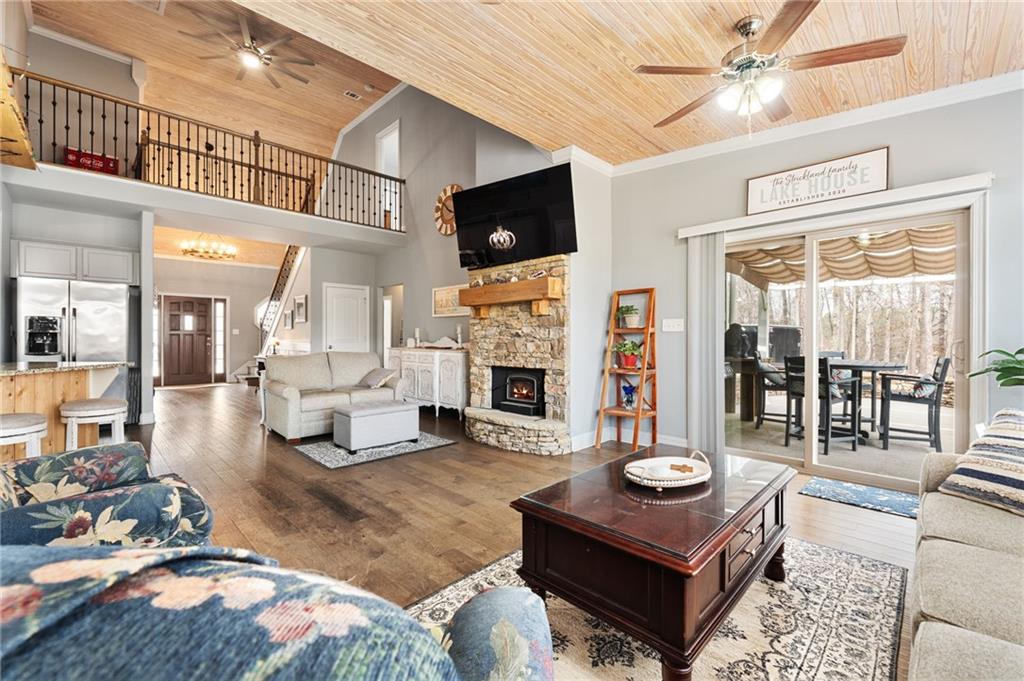 150 Crestview Road Jackson, GA 30233 - Photo 32 of 88 a living room with furniture a flat screen tv and a fireplace