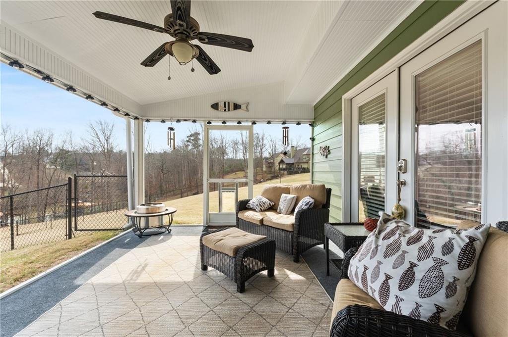 150 Crestview Road Jackson, GA 30233 - Photo 44 of 88 a living room with furniture and a floor to ceiling window