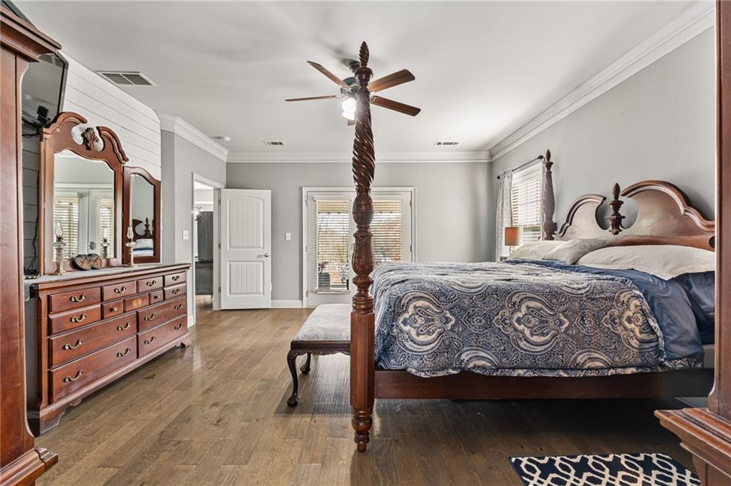 150 Crestview Road Jackson, GA 30233 - Photo 47 of 88 a bedroom with a bed and dresser with mirror