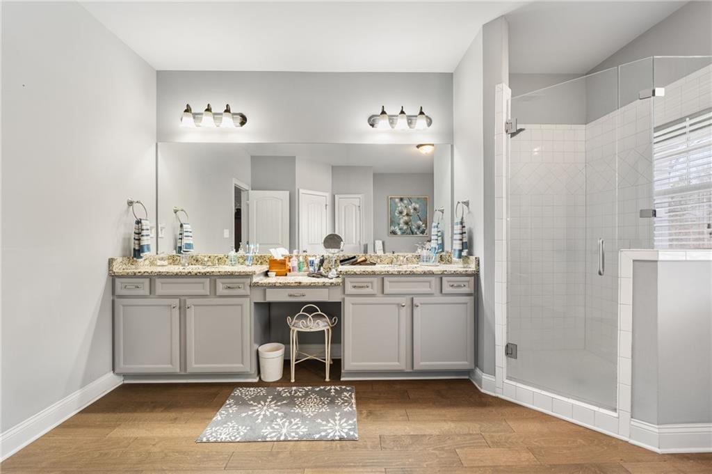 150 Crestview Road Jackson, GA 30233 - Photo 52 of 88 a spacious bathroom with a granite countertop sink a mirror and a vanity
