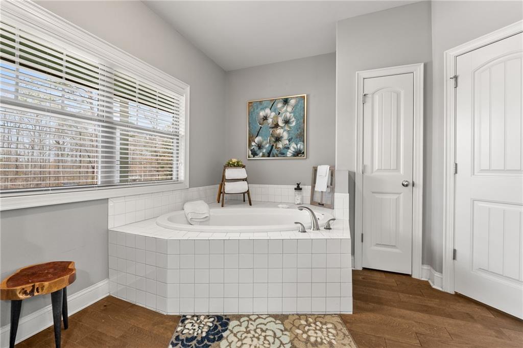 150 Crestview Road Jackson, GA 30233 - Photo 53 of 88 a bathroom with a sink a mirror and a window