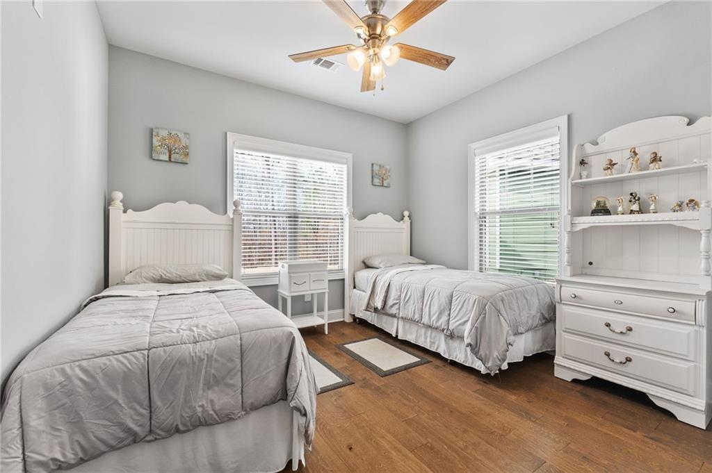 150 Crestview Road Jackson, GA 30233 - Photo 57 of 88 a bedroom with two beds and a chandelier