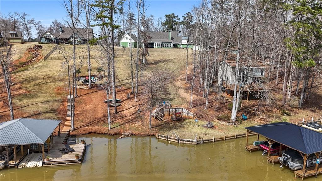 150 Crestview Road Jackson, GA 30233 - Photo 8 of 88 a view of a lake with a house