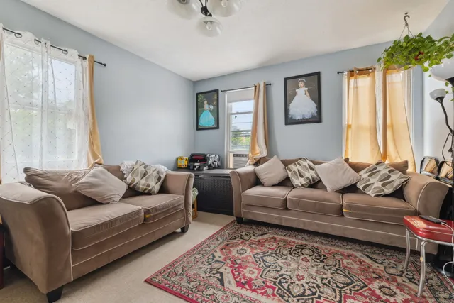 a living room with furniture and a couch