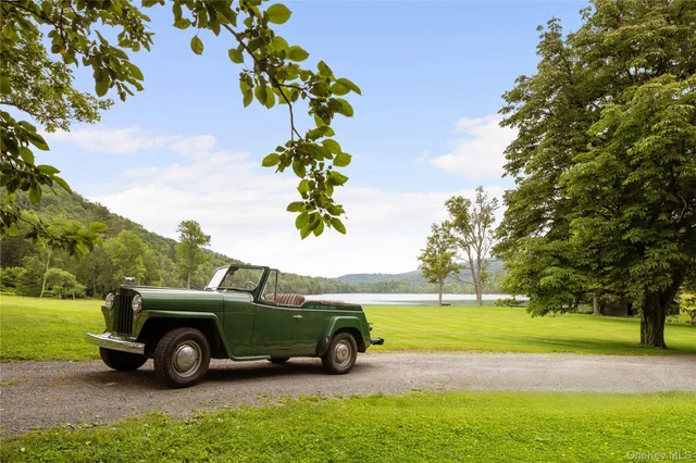 a view of outdoor space with seating area and trees