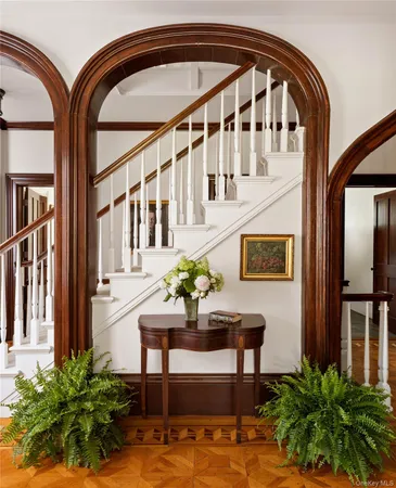 a view of living room filled with furniture and a potted plant